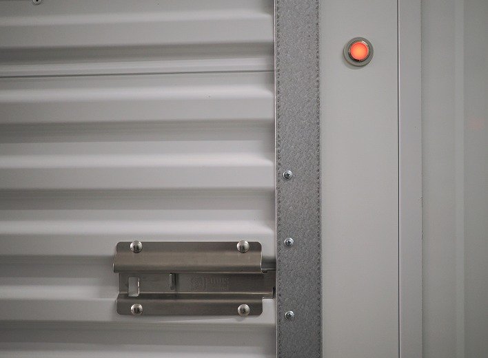 The latch on the unit door, LED showing